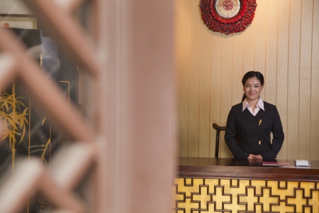 Receptionist at Hotel Front Deskの写真素材