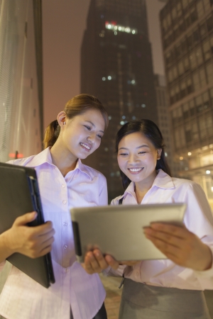 Young businesswomen working outdoorの写真素材
