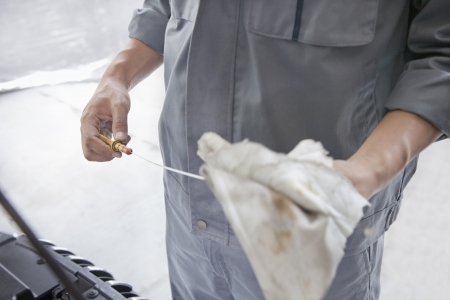 Mechanic Wiping Down Dipstickの写真素材