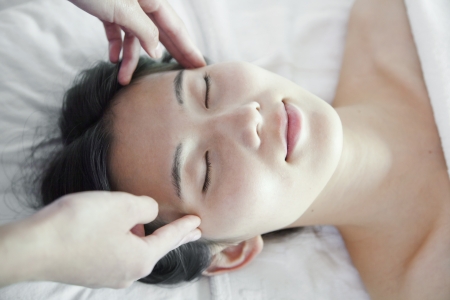 Woman Receiving Head Massageの写真素材