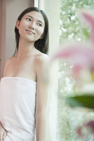 Young Woman Looking out of Spa Windowの写真素材
