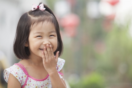 Portrait of Young Girl Laughing in Nanluoguxiang, Beijing, Chinaの写真素材