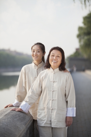 Two Chinese Women With Tai Ji Clothes Smiling At Cameraの写真素材