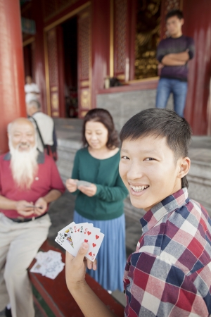 Chinese Family Playing Card In Jing Shan Parkの写真素材