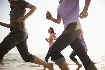 Friends Running at the Beachの写真素材