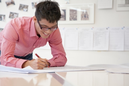 Businessman working on architecture project in the office