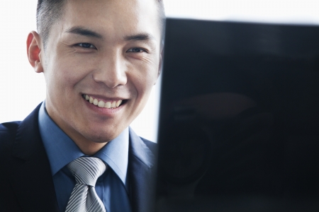 Businessman smiling in officeの写真素材