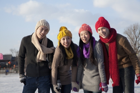 Friends on ice rinkの写真素材