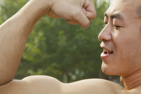 Man Flexing Musclesの写真素材