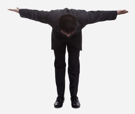 Businessman Bowing Lowの写真素材