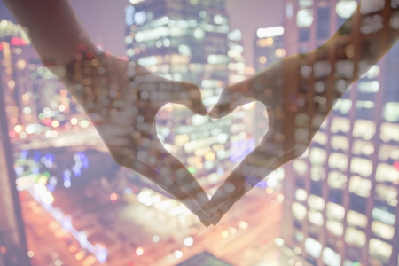 Making Heart Sign with Hands, Night Viewの写真素材