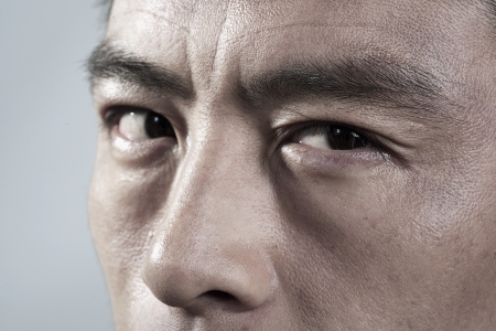Extreme Close up on angry mans faceの写真素材