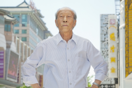 Portrait of senior man outdoors in Beijingの写真素材