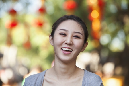 Smiling Young Woman In Nanluoguxiang, Beijingの写真素材