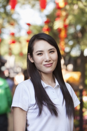 Smiling Young Woman In Nanluoguxiang, Beijingの写真素材