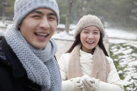 Couple Playing in the Snowの写真素材
