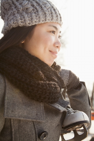 Young woman ice skating portrait, Beijingの写真素材