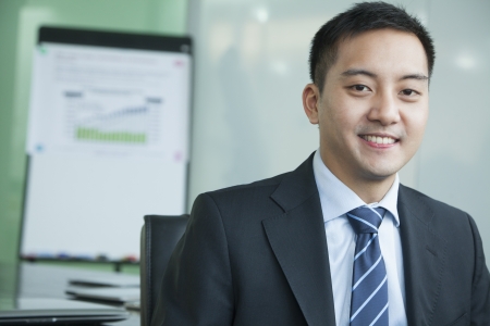 Businessman in meeting room portraitの写真素材