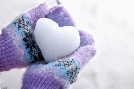 Snow Heart in Hands with Mittensの写真素材