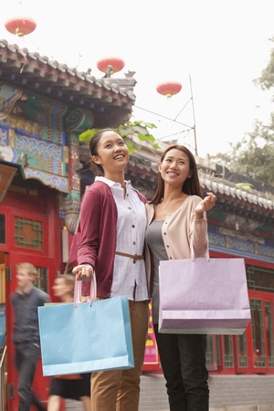 Two Young Women Shopping Outdoorsの写真素材