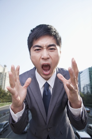 Young Angry Businessman Yellingの写真素材