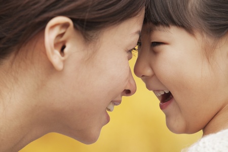 Mother and Daughter face to faceの写真素材