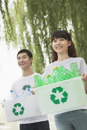 Two Young People Recycling Plastic Bottlesの写真素材