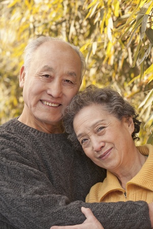 Portrait of senior couple under trees, Beijingの写真素材