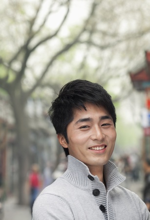 Young Man smiling and looking at cameraの写真素材