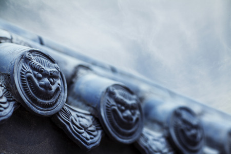 Close-up of carvings on the roof of the pagodaの写真素材