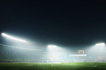 Digital composite of soccer field and night skyの写真素材