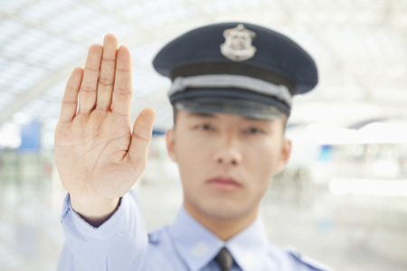 Police Officer Motioning to Stopの写真素材