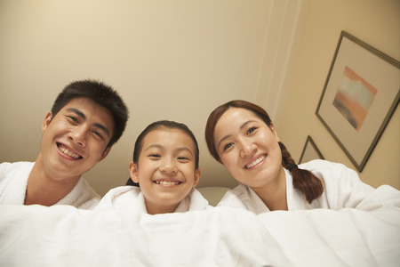 Happy Family in Bedの写真素材