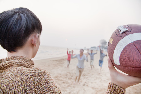 Young Man About to Throw a Footballの写真素材