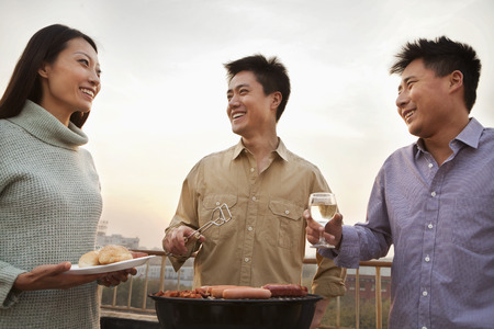 Friends Drinking Over a Barbecueの写真素材