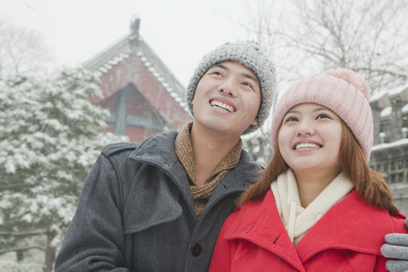 Couple embracing in snowの写真素材