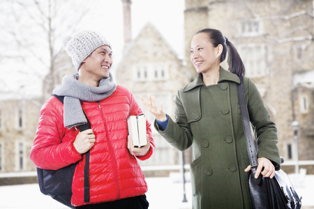 Smiling man and woman in winter clothes