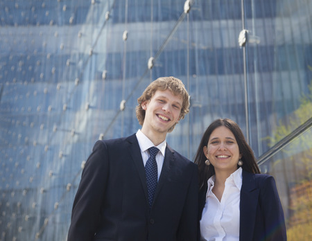 Portrait of two smiling young business people outdoors in Beijing, Chinaの写真素材