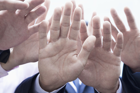 Close-up of four business people's hands