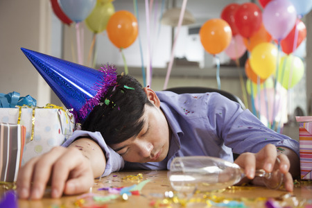 Male Asleep After Party at Officeの写真素材
