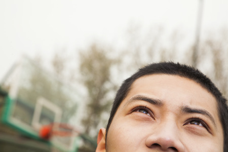 Young man on the basketball court, portrait の写真素材