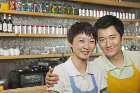 Portrait of two baristas at a coffee shop, Beijingの写真素材