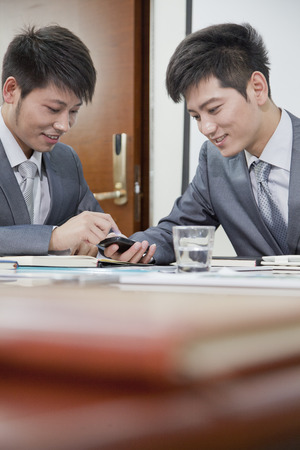 Businessmen Using Mobile Phoneの写真素材