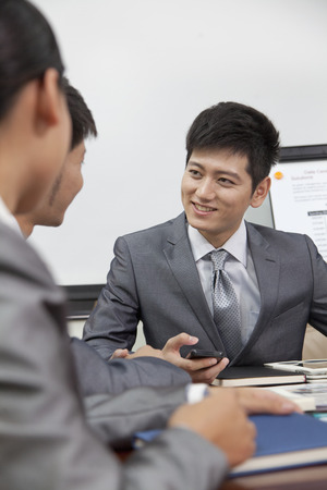 Businesspeople Meeting in a Conference Roomの写真素材
