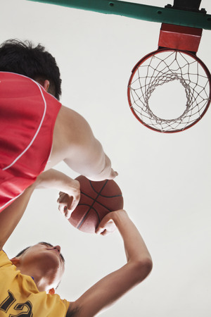 Two people playing basketball, blocking の写真素材