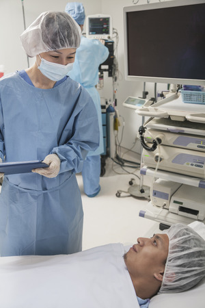 Surgeon consulting a patient, getting ready for surgeryの写真素材