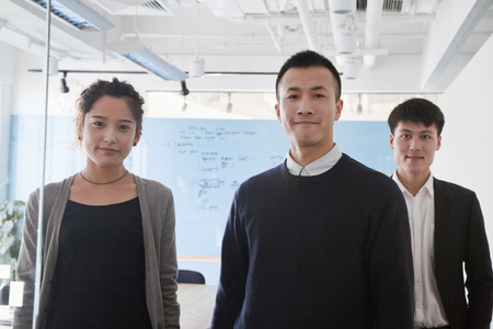 Coworkers in meeting room, portraitの写真素材