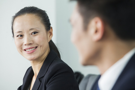 Businesswoman Looking At Colleagueの写真素材