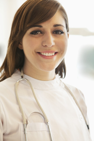 Portrait of smiling young female doctor in a hospital の写真素材
