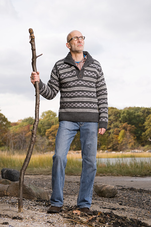 Mature man holding a stickの写真素材